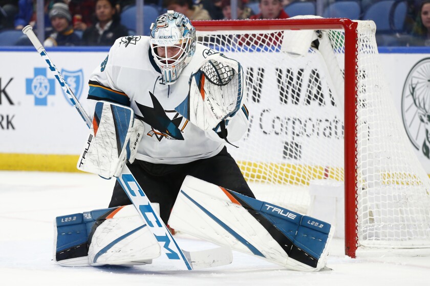 San Jose Sharks goaltender Adin Hill (33) makes a save during the first period of an NHL hockey game against the Buffalo Sabres, Thursday, Jan. 6, 2022, in Buffalo, N.Y. (AP Photo/Jeffrey T. Barnes)