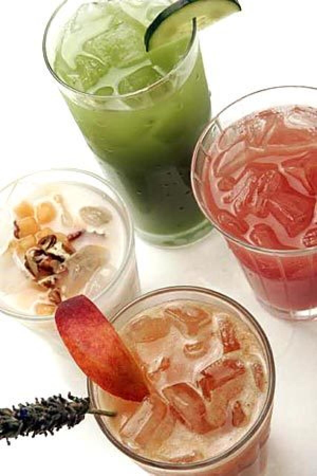 JUICE BAR: Natural summer coolers, clockwise from top: cucumber-lime, watermelon-lime, peach-lavender, and the classic horchata.