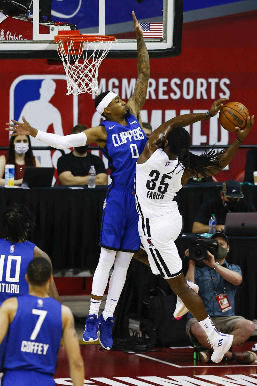 Clippers guard Jay Scrubb jumps up on the court.