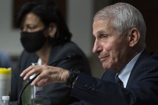 Dr. Anthony Fauci, right, director of the National Institute of Allergy and Infectious Diseases, speaks as Dr. Rochelle Walensky, Director of the Centers for Disease Control and Prevention (CDC) listens during a Senate Health, Education, Labor, and Pensions Committee hearing on Capitol Hill, Thursday, Nov. 4, 2021, in Washington. (AP Photo/Alex Brandon)