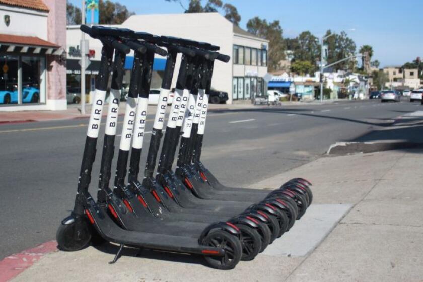 Electric scooter ridership has dropped by half since the summer, according to new City figures. Pictured are scooters parked on La Jolla Boulevard.
