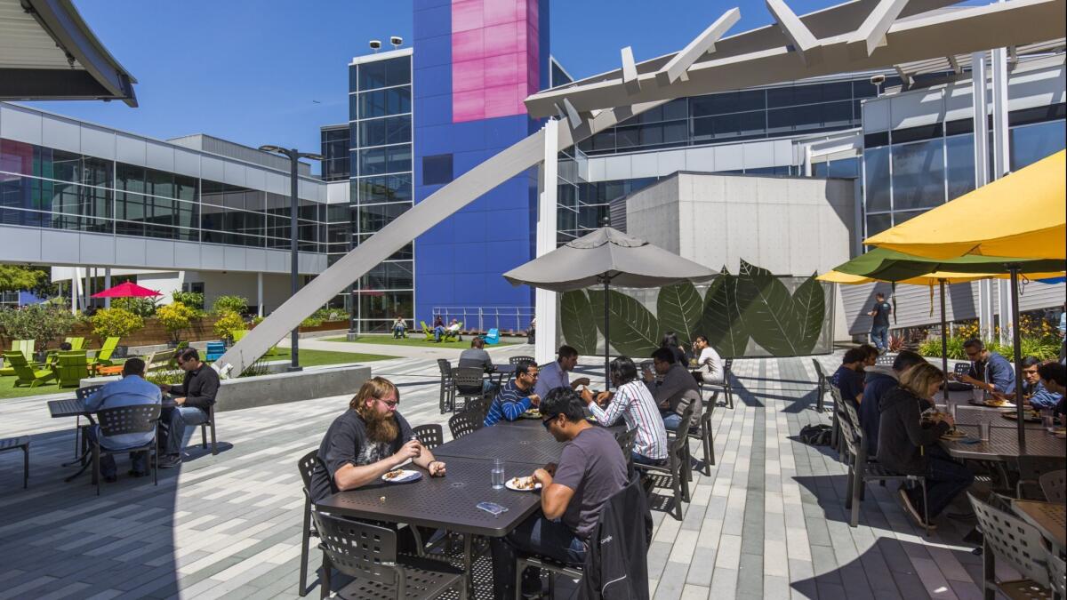 But where do they live? Google employees enjoy outdoor lunch at Google's headquarter complex in Mountain View.