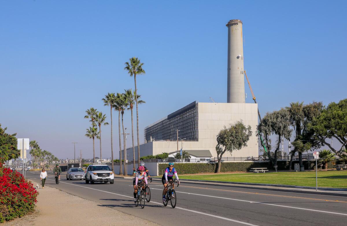 A north-facing view of Carlsbad Boulevard, where cyclists and cars pass the Encina power plant.