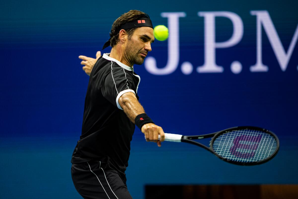 Roger Federer hits a backhand during his victory over Sumit Nagal in the first round of the U.S. Open on Monday.