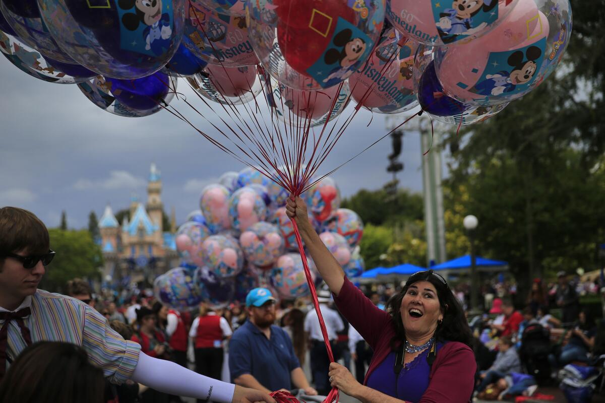 Stephanie Gwinn of Norco enjoys the scene at Disneyland during the theme park's Diamond Celebration.