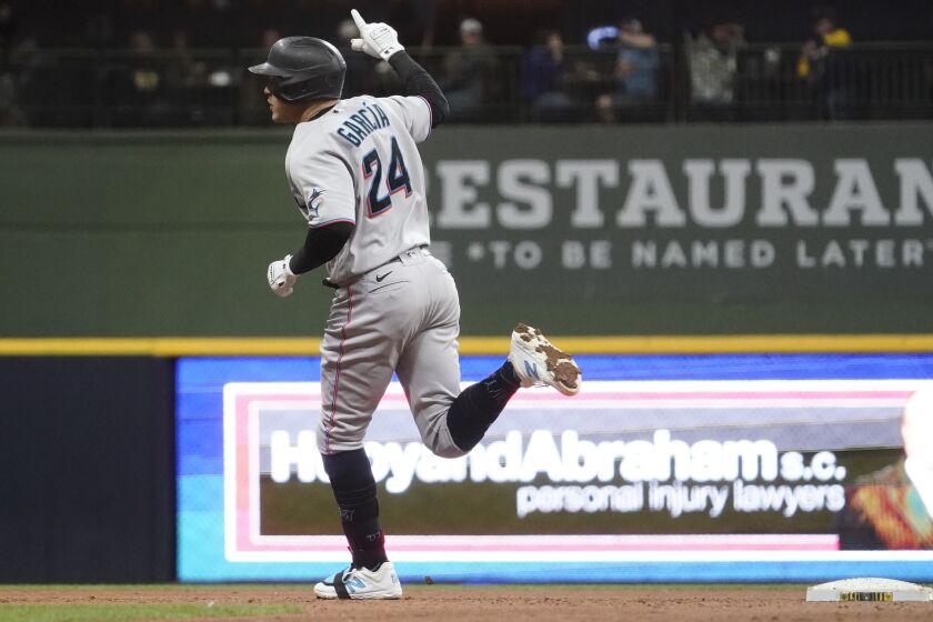 Miami Marlins' Avsail Garcia reacts after hitting a grand slam during the eighth inning of a baseball game against the Milwaukee Brewers Thursday, Sept. 29, 2022, in Milwaukee. (AP Photo/Morry Gash)