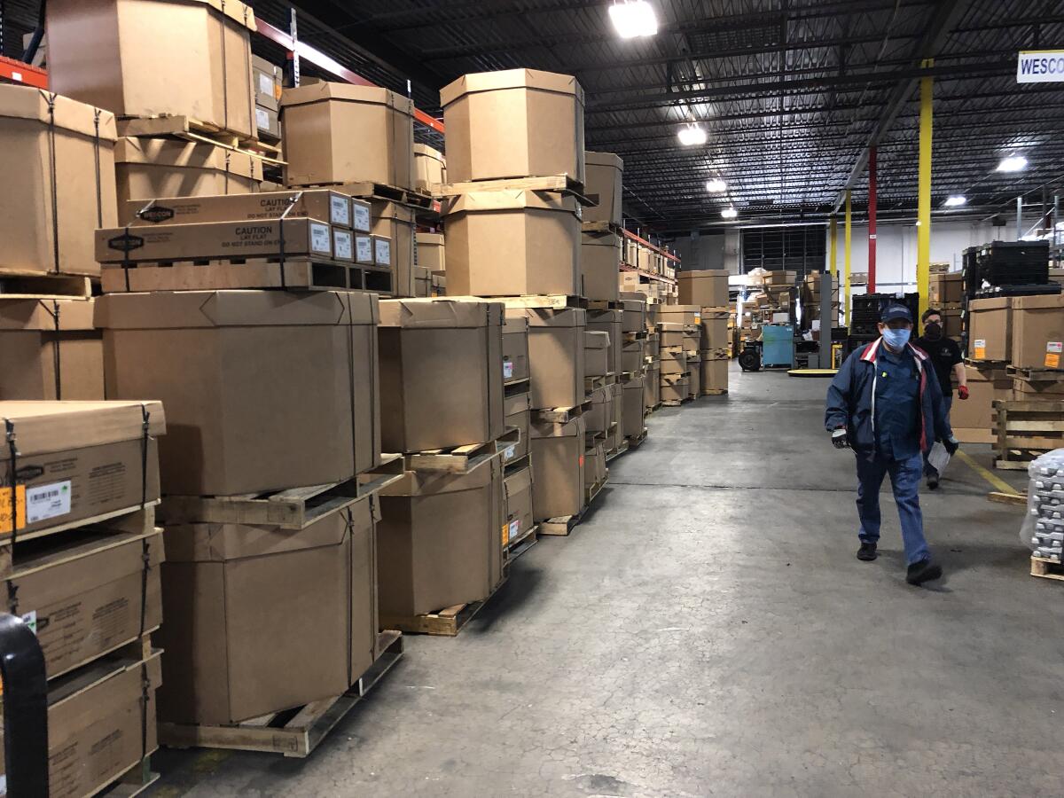 Boxes stack up at a TECMA Group warehouse