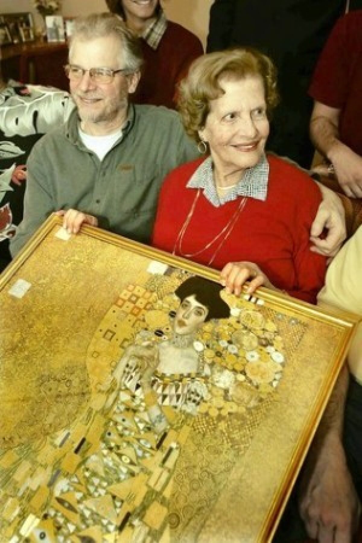 Maria Altmann, with son Peter, holds a print of "Portrait of Adele Bloch-Bauer."