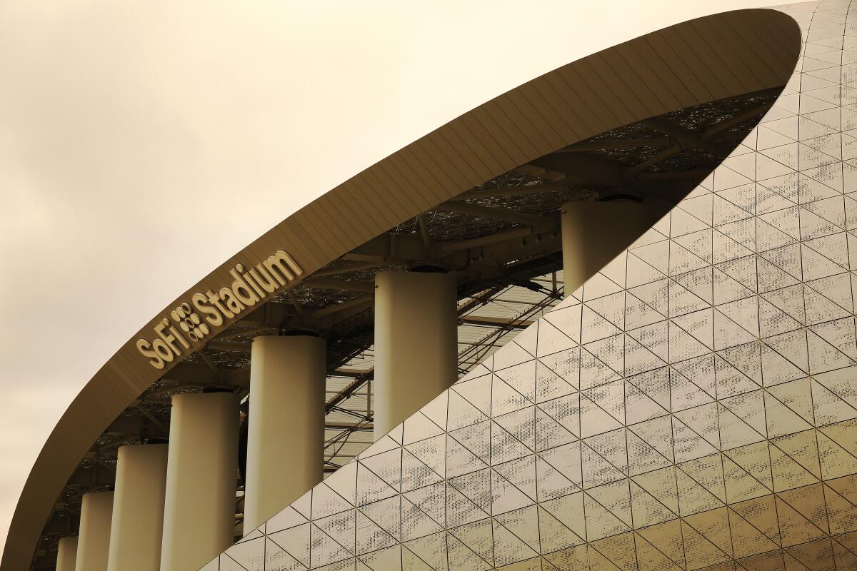 The exterior of SoFi Stadium on an overcast day