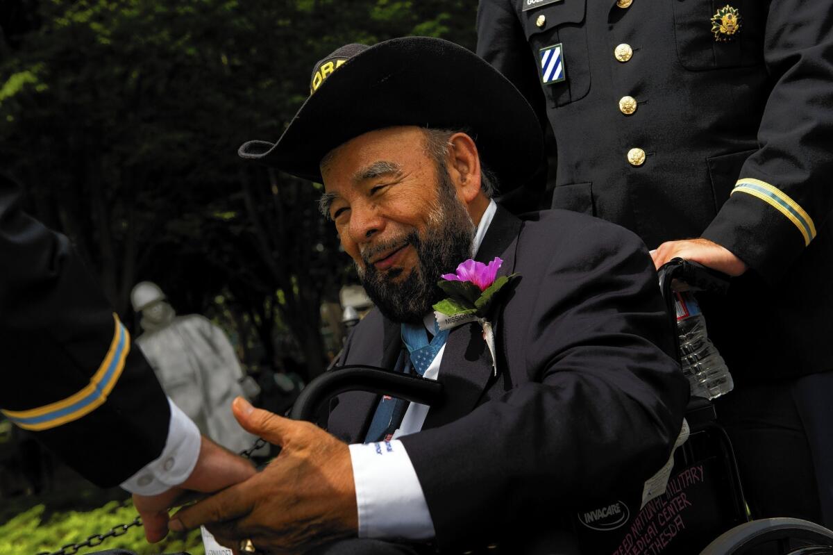 Rudy Hernandez greets friends at an event commemorating the 60th anniversary of the Korean War on July 27, 2013, in Washington, D.C. President Truman awarded him the Medal of Honor in April 1952.