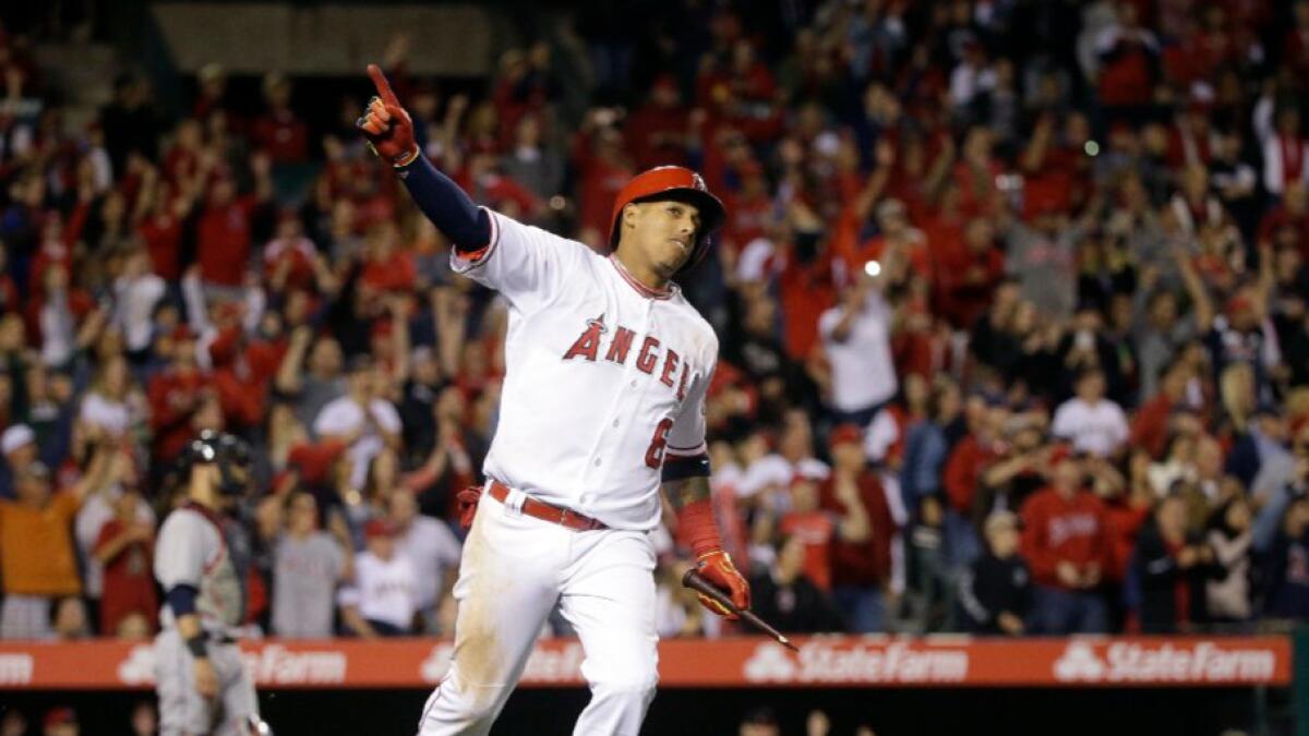 Angels infielder Yunel Escobar celebrates his walk-off single against the Indians during a game on June 11.