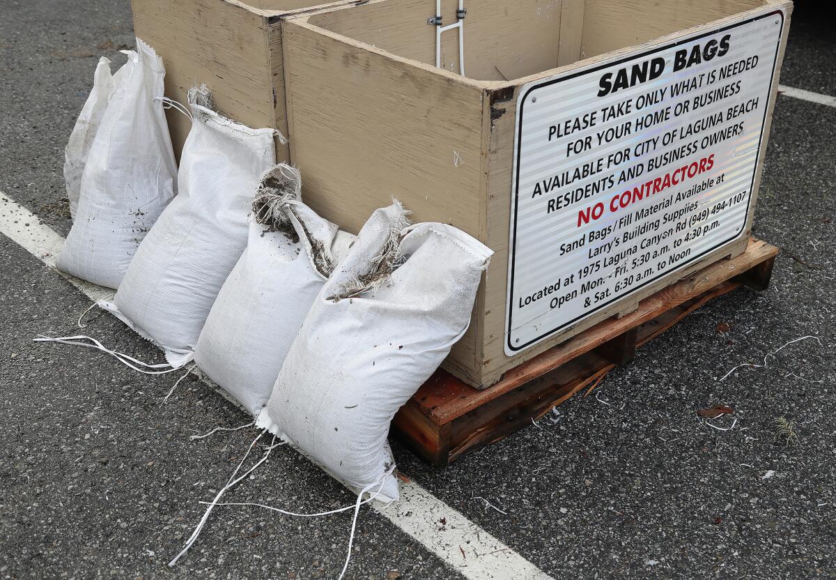 Sand bags are at the ready in the Act V Parking Lot at 1900 Laguna Canyon Road in case flooding occurs in downtown Laguna.