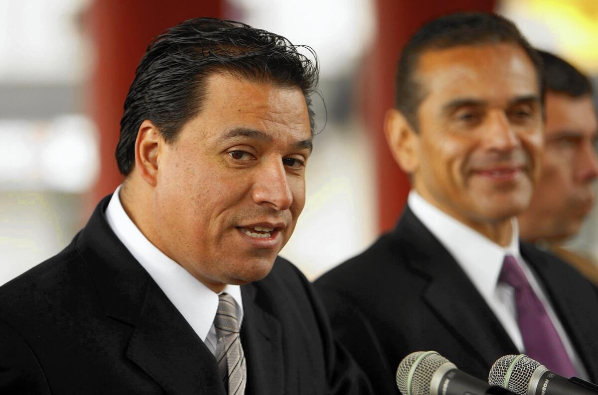 In his debate with Gloria Molina, L.A. City Councilman Jose Huizar, left, shown with then-Mayor Antonio Villaraigosa in 2012, emphasized his work implementing "road diets," reducing the number of car lanes on major streets and allocating more space for bicyclists and pedestrians.