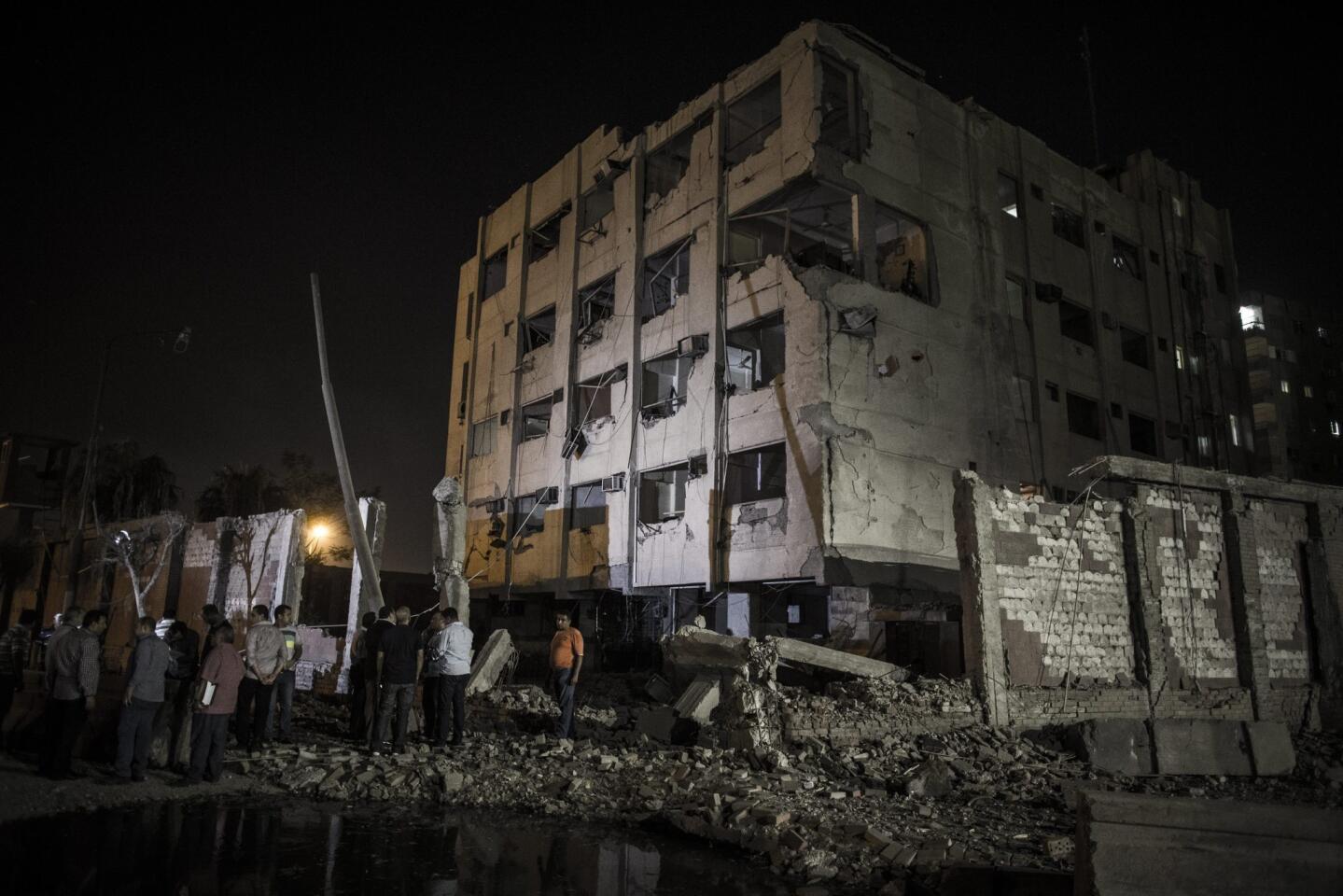 The scene where a bomb detonated next to a national security building in the Shubra neighborhood of Cairo, Egypt, early August 20, 2015.