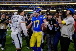 INGLEWOOD, CA - DECEMBER 8, 2022: Rams quarterback Baker Mayfield is congratulated.