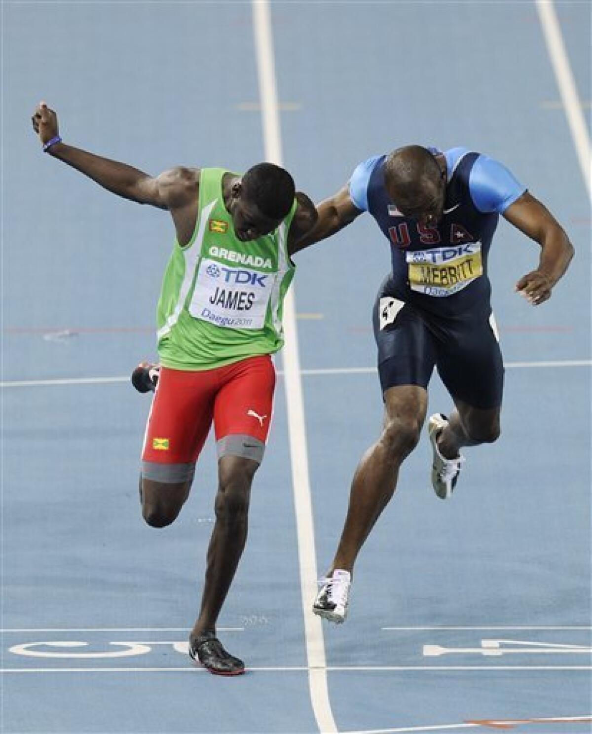 Grenada's Kirani James, left, crosses the finish line ahead of USA's LaShawn Merritt in the Men's 400m final at the World Athletics Championships in Daegu, South Korea, Tuesday, Aug. 30, 2011. (AP Photo/Martin Meissner)