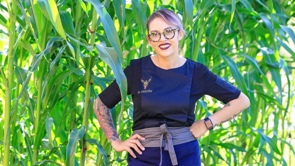 Chef Claudette Zepeda-Wilkins, amid the towering corn in the garden —jardín — of her exciting regional Mexican restaurant El Jardín at Liberty Station.