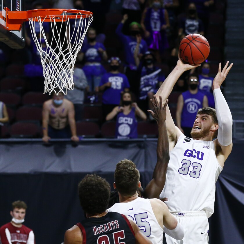 Grand Canyon's Asbjørn Midtgaard (33) shoots against New Mexico State during the first half of an NCAA college basketball game for the championship of the Western Athletic Conference men's tournament Saturday, March 13, 2021, in Las Vegas. (AP Photo/Chase Stevens)