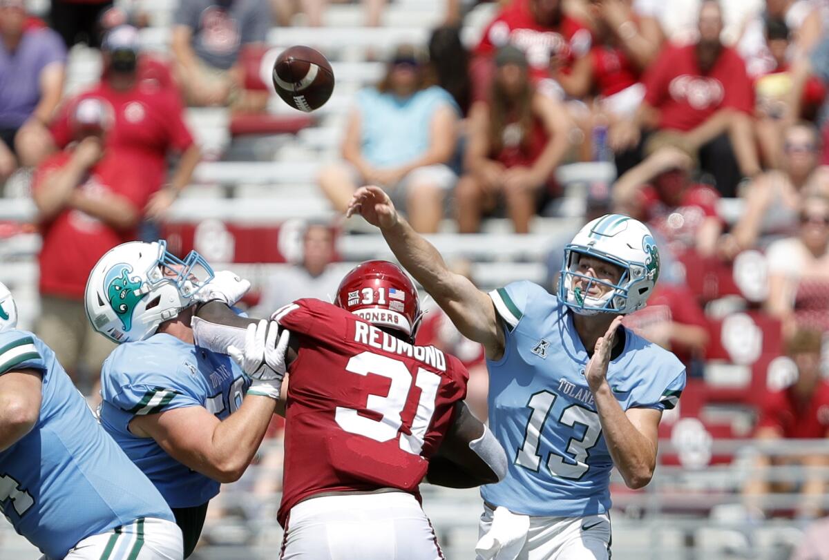Tulane quarterback Justin Ibieta (13) throws a pass against Oklahoma during a NCAA college football game Saturday, Sept. 4, 2021, in Norman, Okla. (AP Photo/Alonzo Adams)
