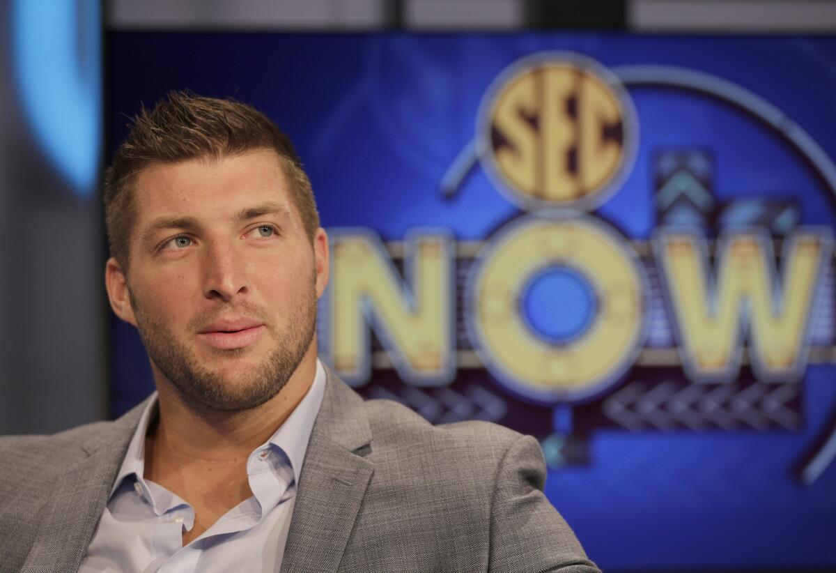 Tim Tebow answers a question on the set of ESPN's new SEC Network in Charlotte, N.C., last month.