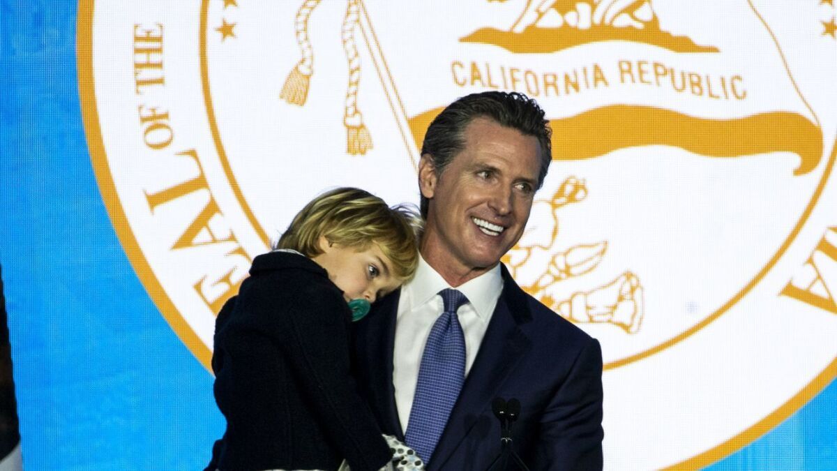 California Gov. Gavin Newsom, shown with son Dutch during his inauguration, issued a statement Monday supporting LAUSD teachers.