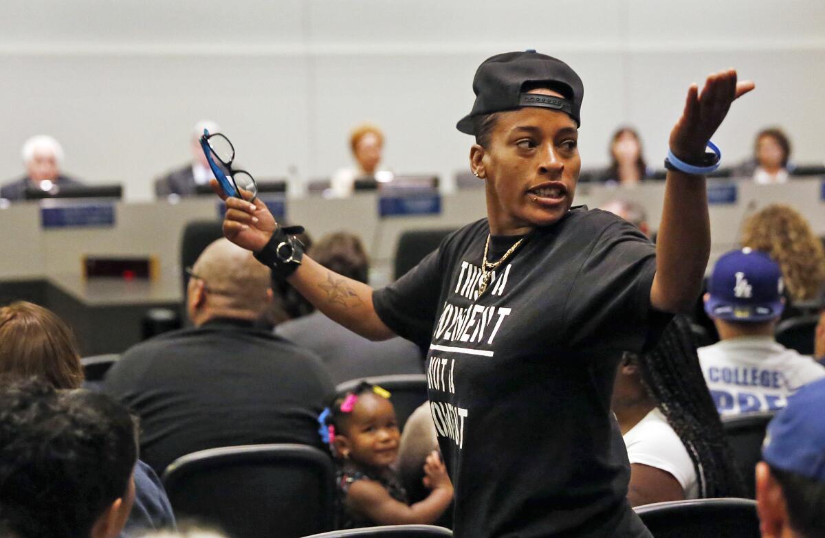 Jasmine Richards gestures during the Los Angeles Police Commission meeting at LAPD headquarters on Tuesday. Police Protective League officials and a few activists attended the first public gathering since the commission decided last week to fault the officers involved in the fatal shooting of Ezell Ford last summer.
