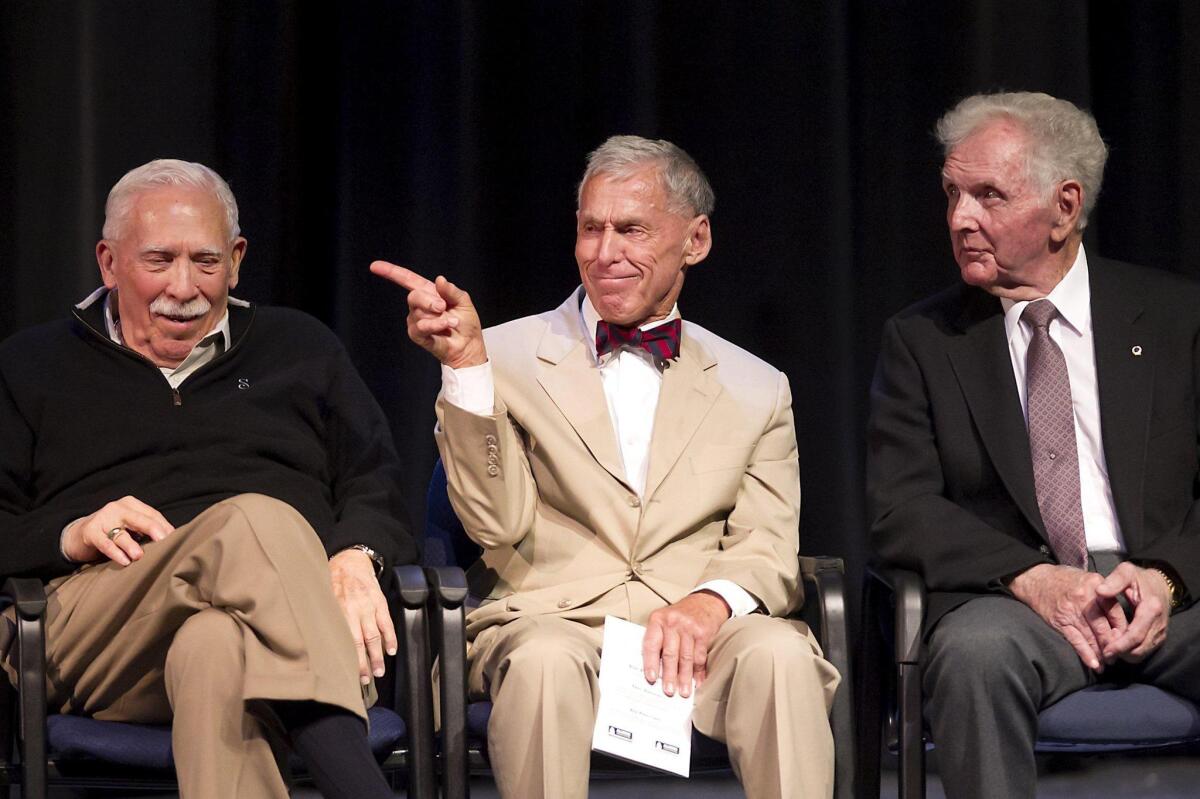 Inductees E. Gene Crain, David Grant and Roger Neth, from left, laugh as Grant is announced during the Newport Harbor High School Alumni Assn.’s third annual Hall of Fame induction ceremony on Wednesday at Newport Harbor High.