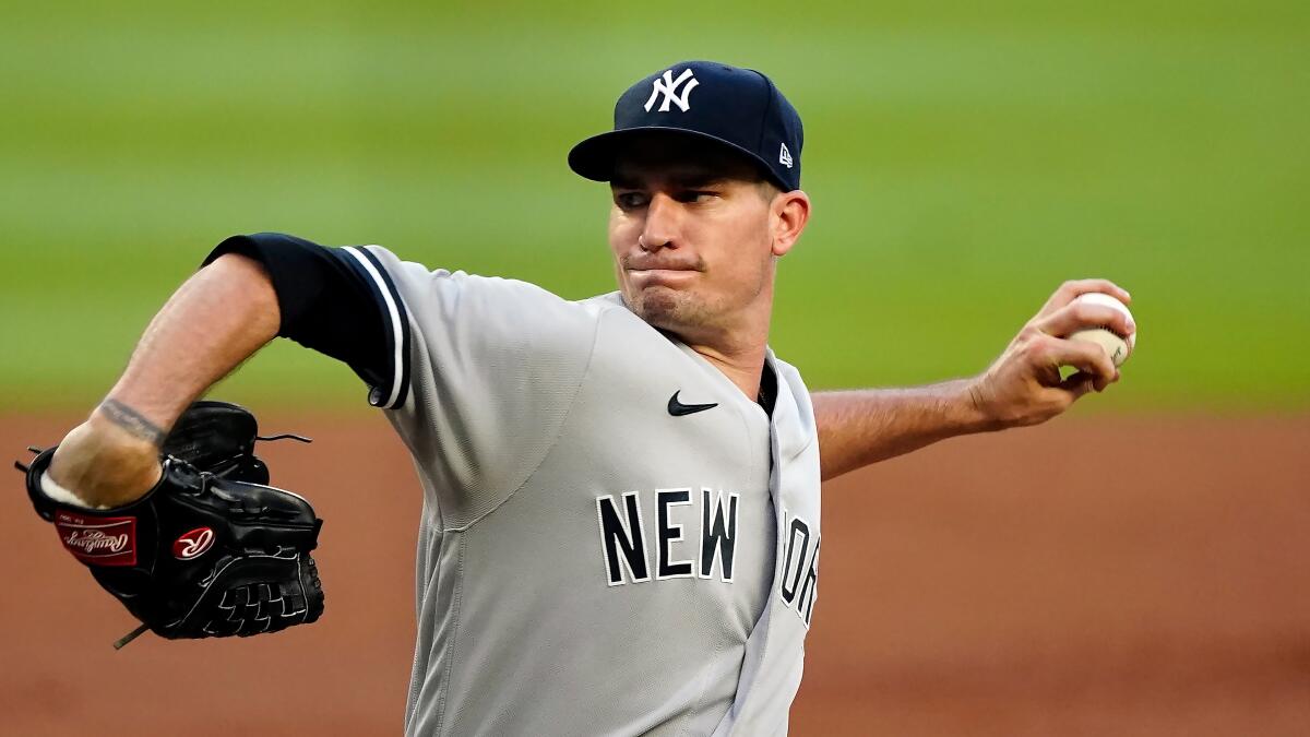 New York Yankees starting pitcher Andrew Heaney delivers against the Atlanta Braves on Aug. 24.