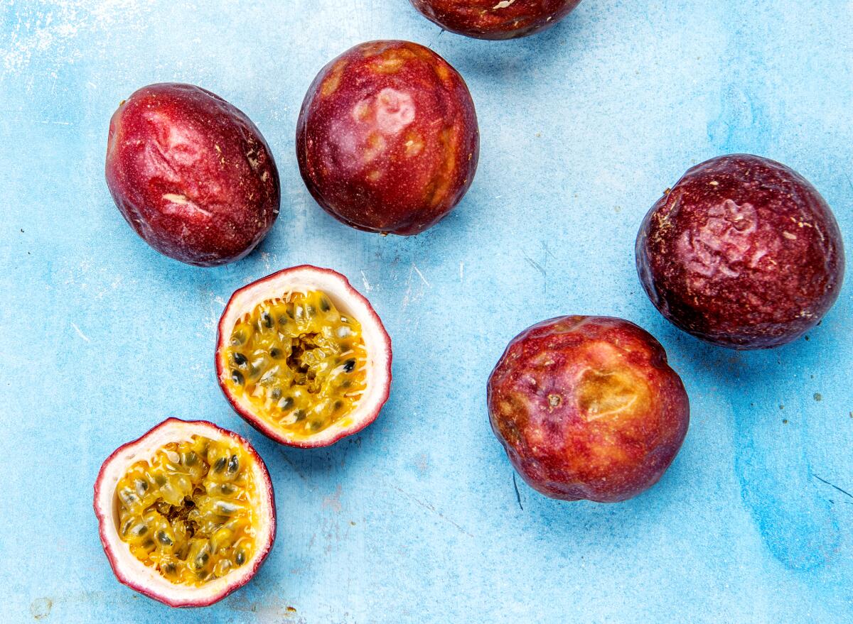 Whole and halved passion fruits