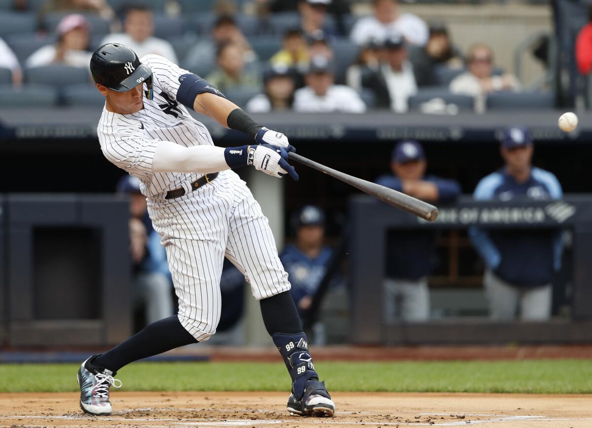 New York Yankees' Aaron Judge hits a single during the first inning a baseball game against the Tampa Bay Rays on Sunday, Sept. 11, 2022, in New York. (AP Photo/Noah K. Murray)