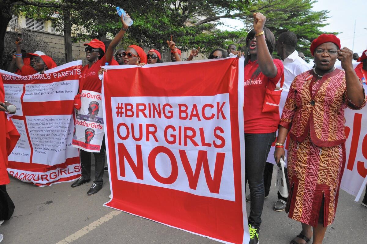 Demonstrators in Abuja on Oct. 20 call for the Nigerian government to rescue schoolgirls kidnapped by the militant group Boko Haram in the spring.