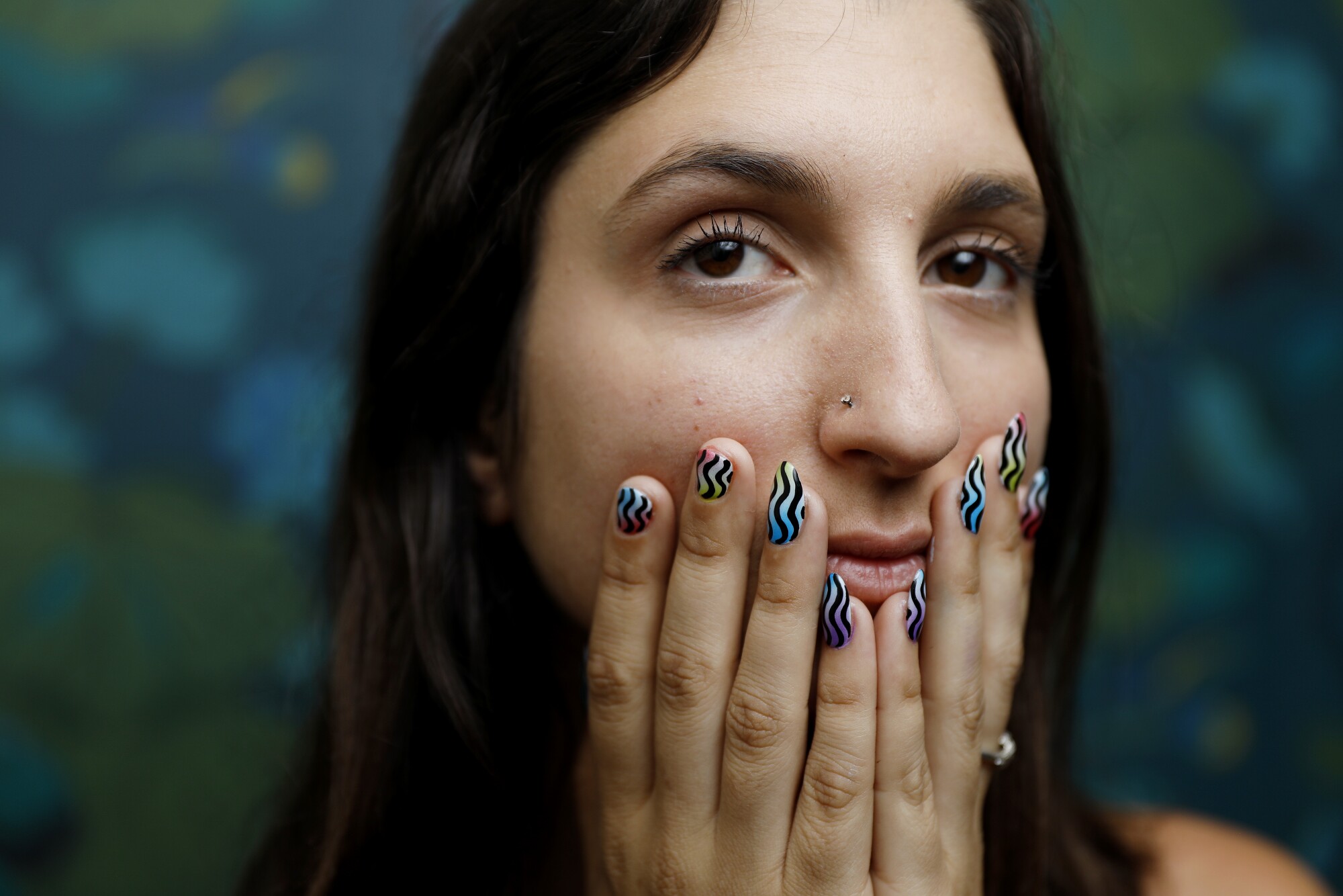 A woman shows off her manicure.