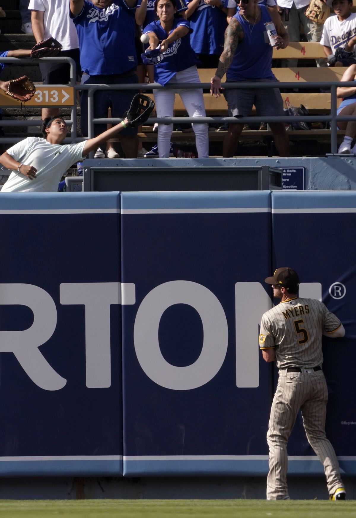 Padres center fielder Wil Myers watches as a ball hit by the Dodgers' Cody Bellinger clears the wall for a solo home run