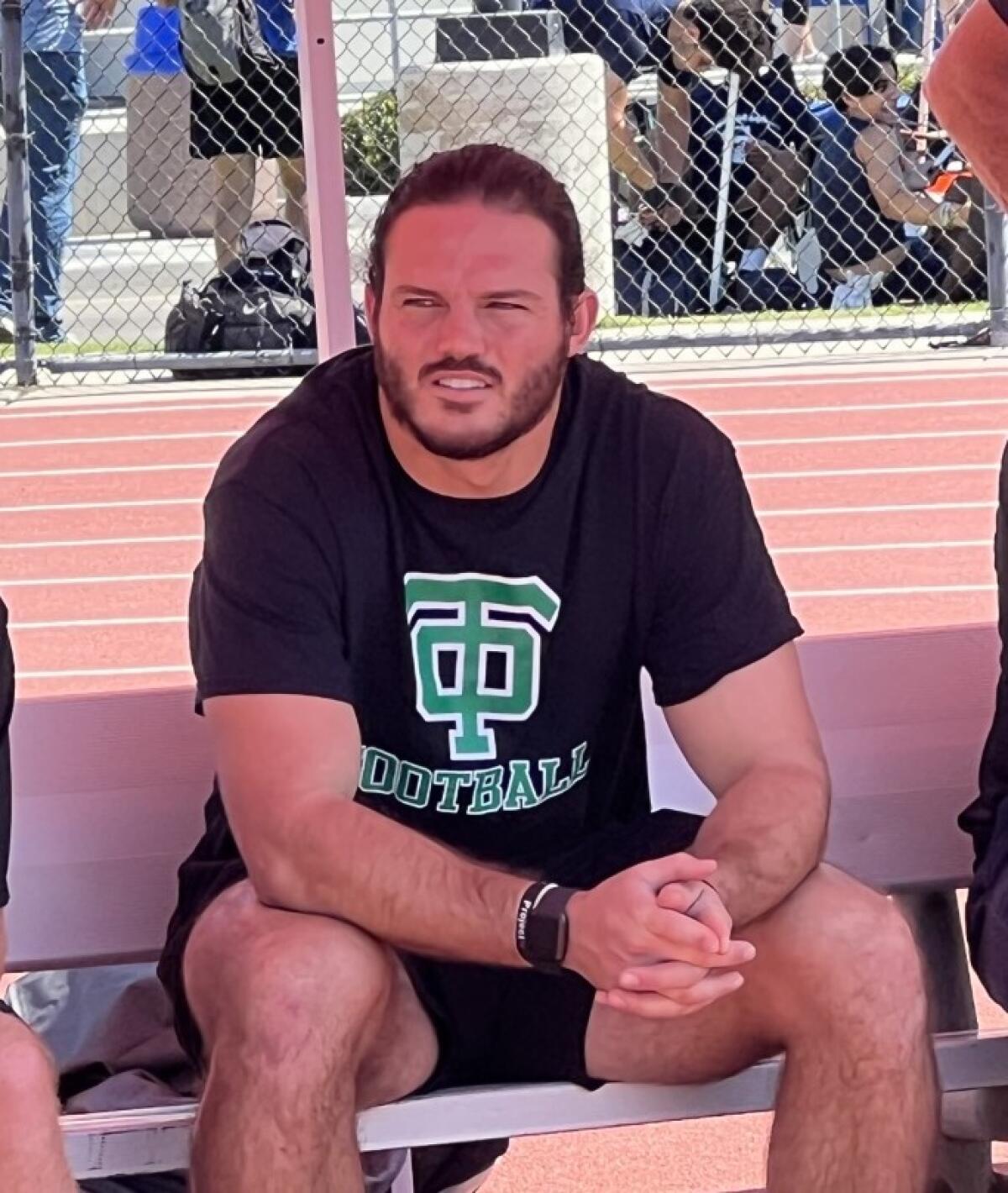 Alex Singleton wears a Thousand Oaks football shirt.