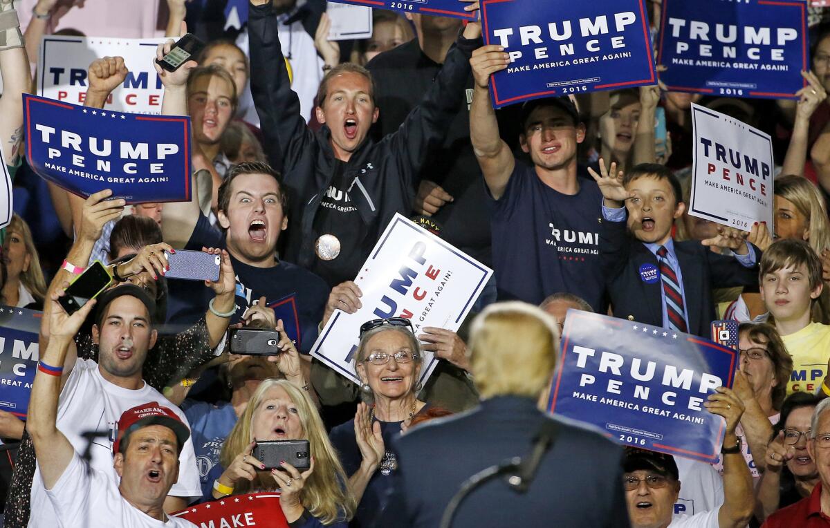 In 2016, supporters cheer Republican presidential candidate Donald Trump at a campaign rally in Prescott Valley, Ariz.