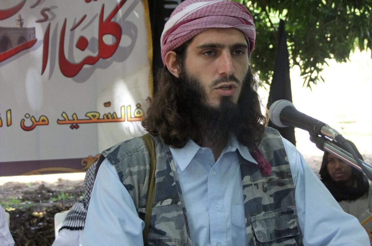 In this Wednesday, May 11, 2011 file photo, American-born Islamist militant Omar Hammami addresses a press conference of the militant group al-Shabab at a farm in southern Mogadishu's Afgoye district in Somalia.