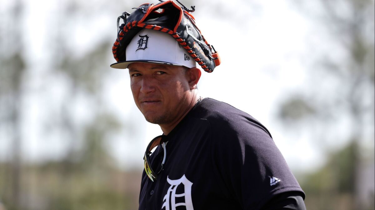 The Tigers' Miguel Cabrera walks on the field as the team does fielding drills at baseball spring training camp, Thursday, Feb. 22, 2018, in Lakeland, Fla.