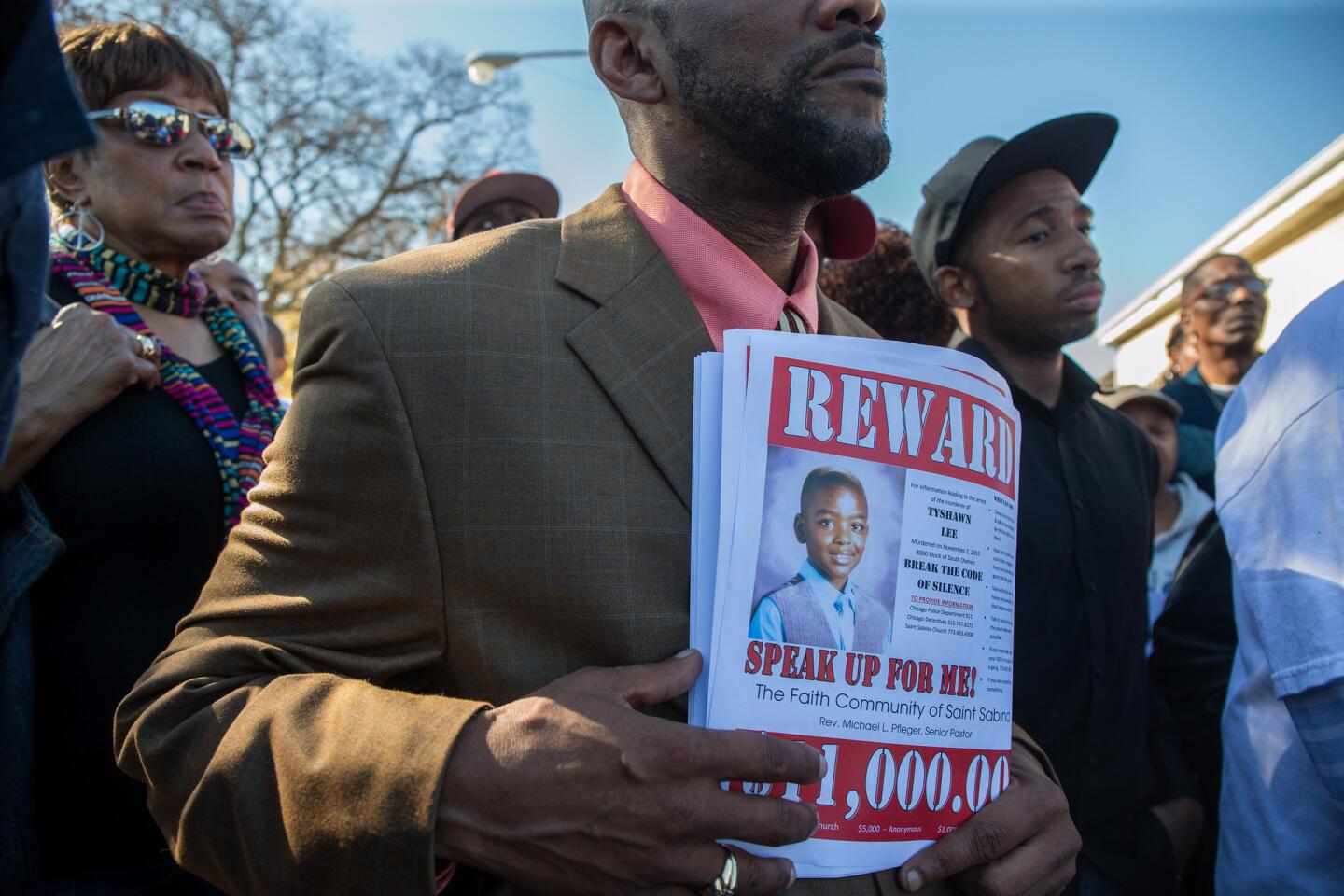 Fliers advertise a reward offered by St. Sabina Catholic Church and other area churches in the shooting death of 9-year-old Tyshawn Lee on Nov. 3, 2015. The boy was fatally shot a day earlier in the 8000 block of South Damen Avenue in Chicago's Gresham neighborhood.