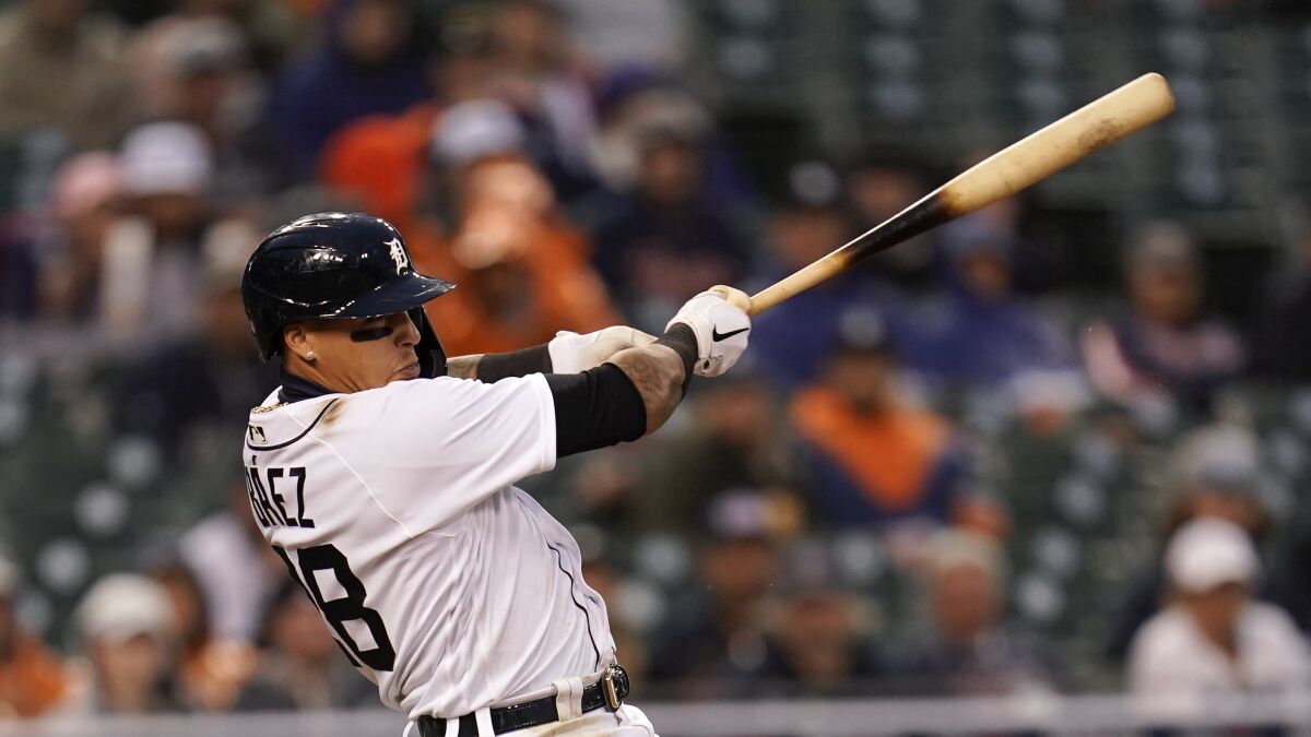 Detroit Tigers' Javier Baez hits a two-run home run against the Boston Red Sox in the eighth inning of a baseball game in Detroit, Monday, April 11, 2022. (AP Photo/Paul Sancya)