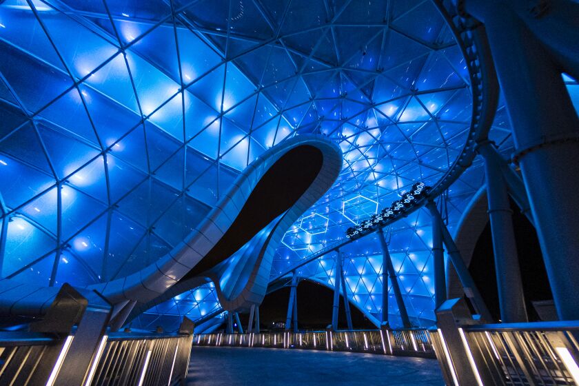 The building for TRON Lightcycle / Run, opening April 4, is a magnificent structure that creates a sense of motion.