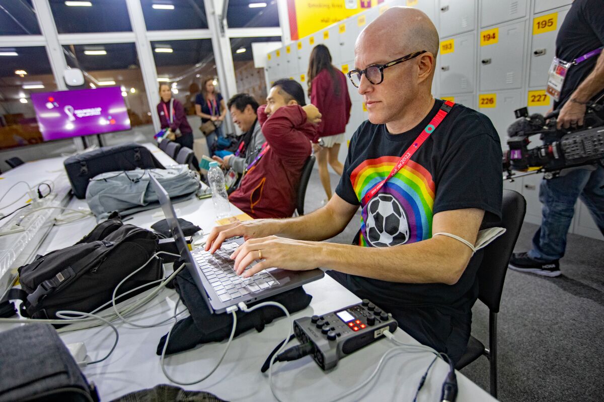 Soccer journalist Grant Wahl works in the FIFA media center before a match on Nov. 21.