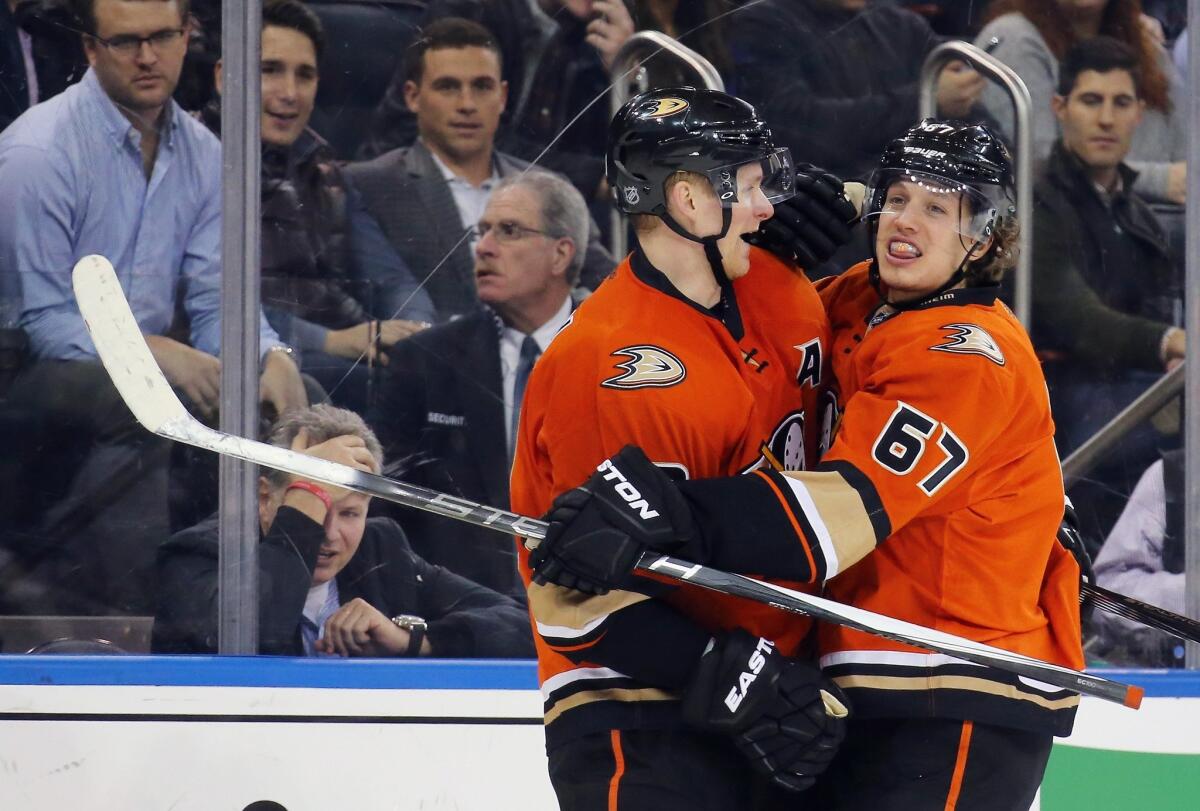Corey Perry, left, and Rickard Rakell celebrate after a goal against the New York Rangers on Dec. 22.