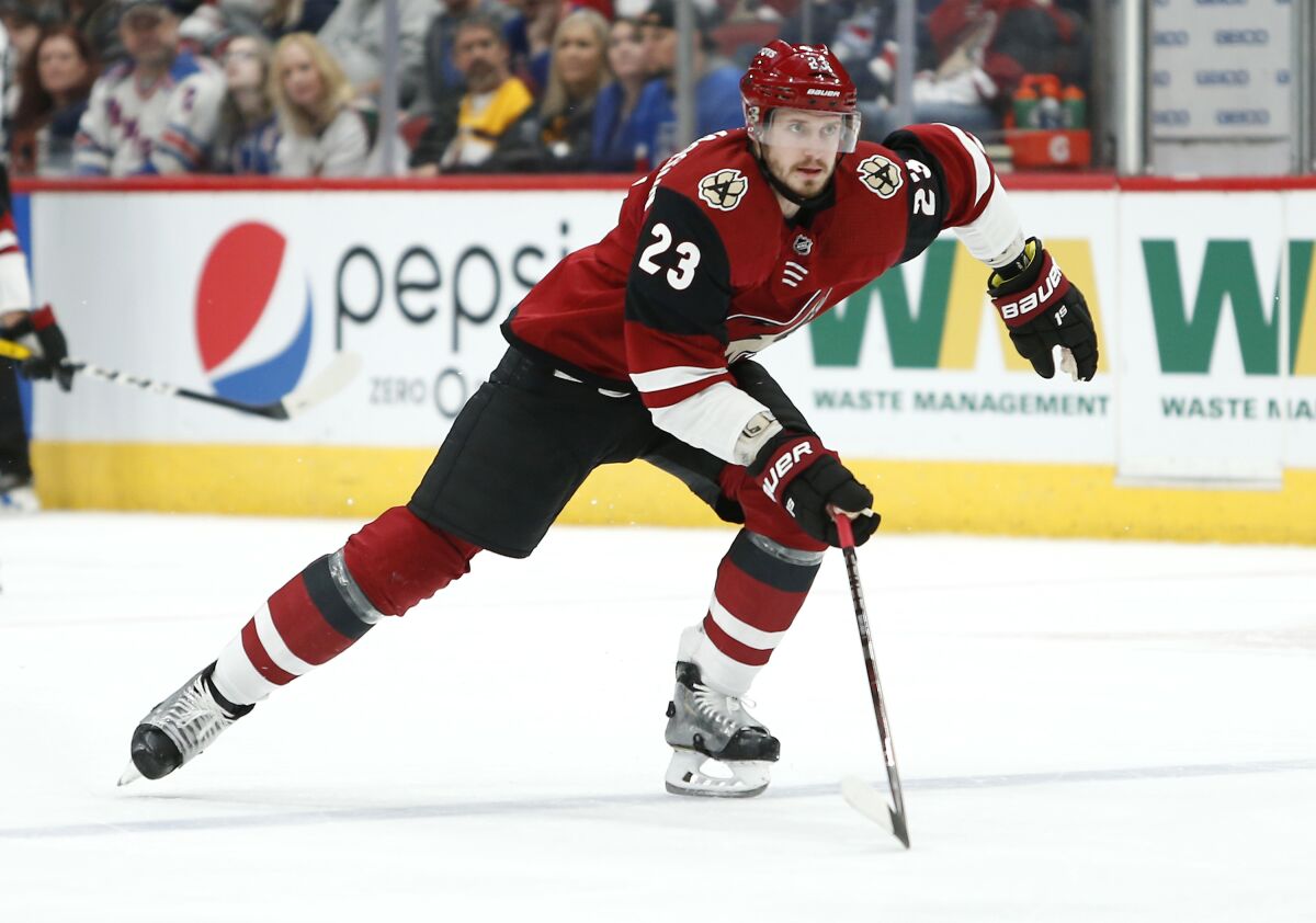 FILE - This Jan. 6, 2019, file photo shows Arizona Coyotes defenseman Oliver Ekman-Larsson skating against the New York Rangers during the first period of an NHL hockey game in Glendale, Ariz. Coyotes captain Oliver Ekman-Larsson labored through the first part of the 2019-20 season as a knee injury lingered. The time off during the NHL's shutdown and a trip home to Sweden allowed the defenseman a chance to heal, giving the Coyotes a boost as the postseason nears. (AP Photo/Ralph Freso, File)