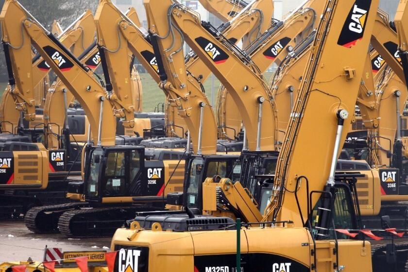 Caterpillar Inc. cut its full-year sales and profit forecast amid a slowdown in orders for mining equipment.