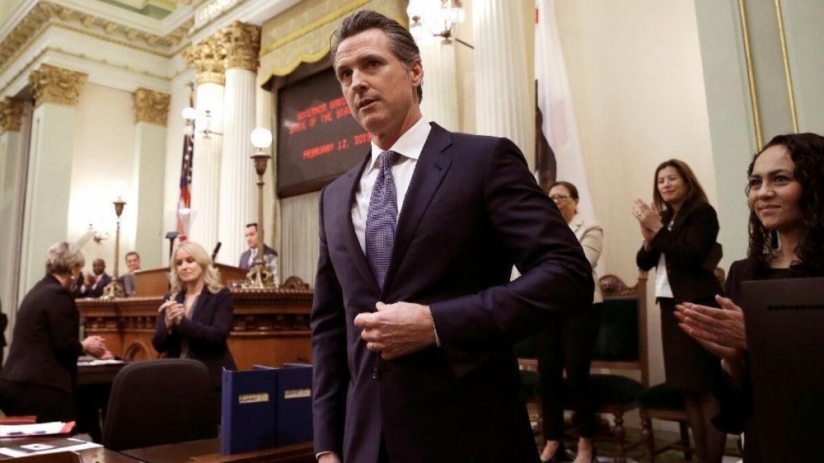 Gov. Gavin Newsom receives applause after delivering his first State of the State address at the Capitol building in Sacramento on Feb. 12.