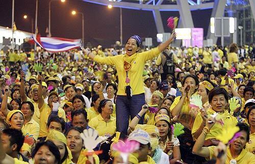 Members of the Peoples Alliance for Democracy swarm a departure area at Suvarnabhumi Airport in Bangkok, temporarily halting all outbound flights. The protesters are seeking the ouster of Thai Prime Minister Somchai Wongsawat.