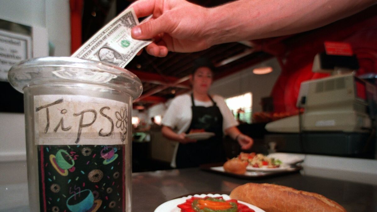Tips go up two percentage points if a server writes "Thank You" on the back of a patron's check, research found.