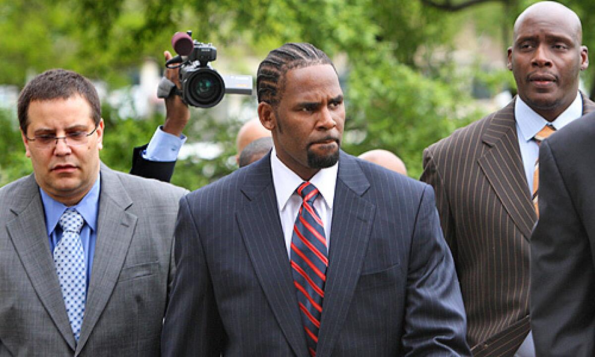 R&B star R. Kelly, 41, arrives at the Cook County Criminal Courts Building for his child pornography trial Tuesday, May 20, 2008, in Chicago. A jury acquitted the R&B superstar on June 13, 2008. Read the story.