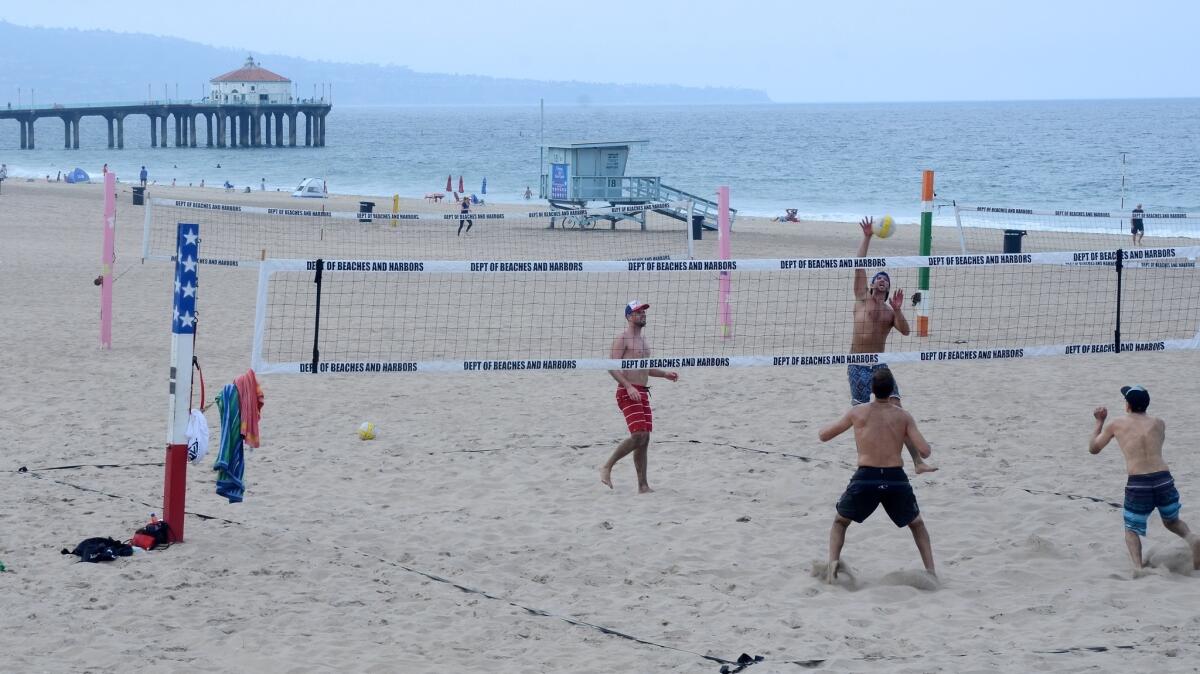 Casual volleyball action, just north of the pier, in Manhattan Beach.