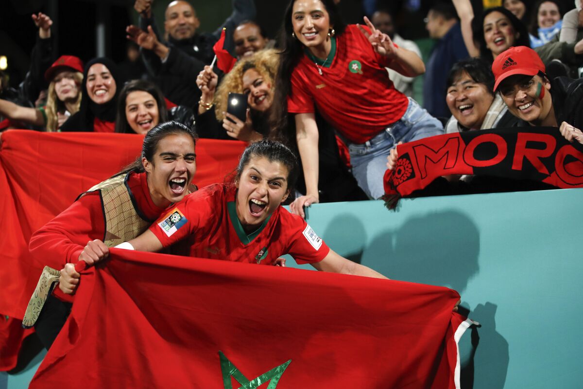 Morocco's Nesryne El Chad, center, celebrates with fans after the Women's World Cup Group H soccer match between Morocco and Colombia in Perth, Australia, Thursday, Aug. 3, 2023. (AP Photo/Gary Day)